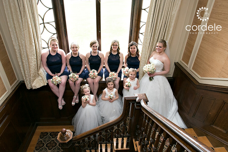 Bridesmaids sit in bay window of Endicott Estate