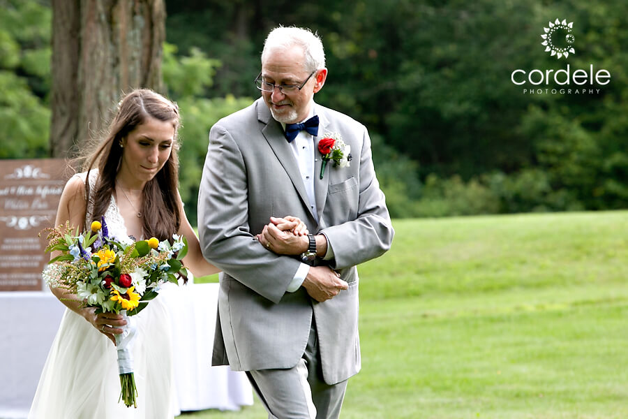 father and bride walking