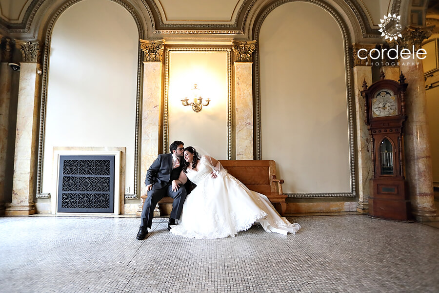 Bride and Groom sitting on bench